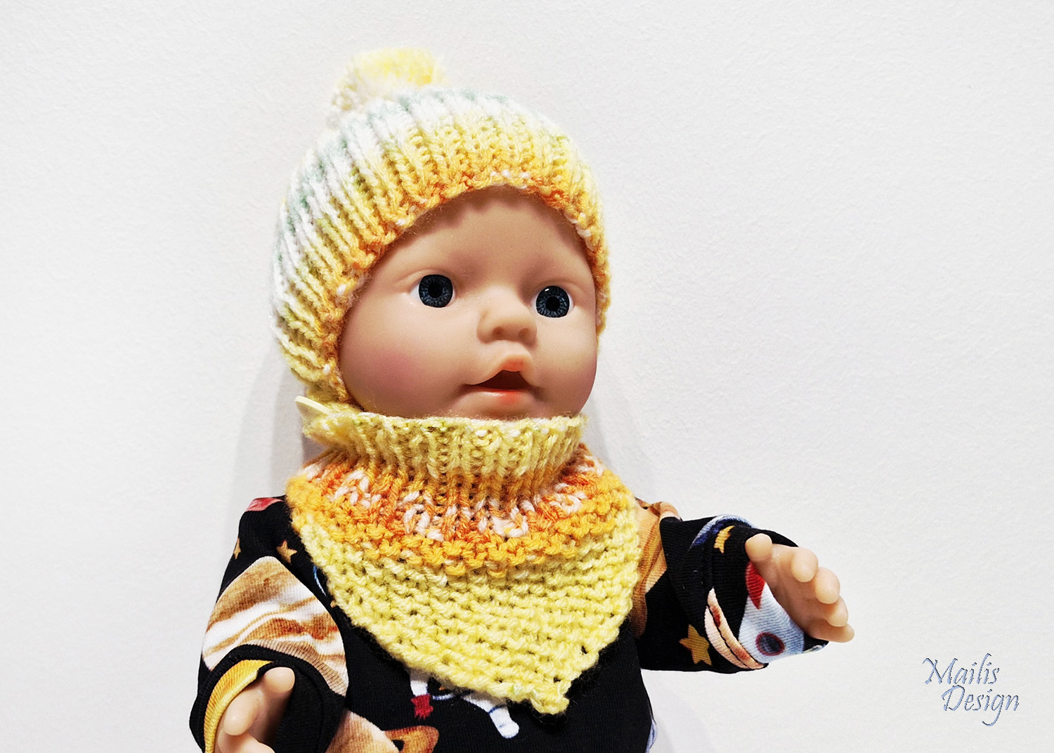Nuku müts (pü 28cm) ja kaelussall, oranži kirju